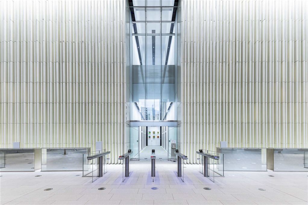 Kumahira UG series safe gates in a light-filled tower lobby